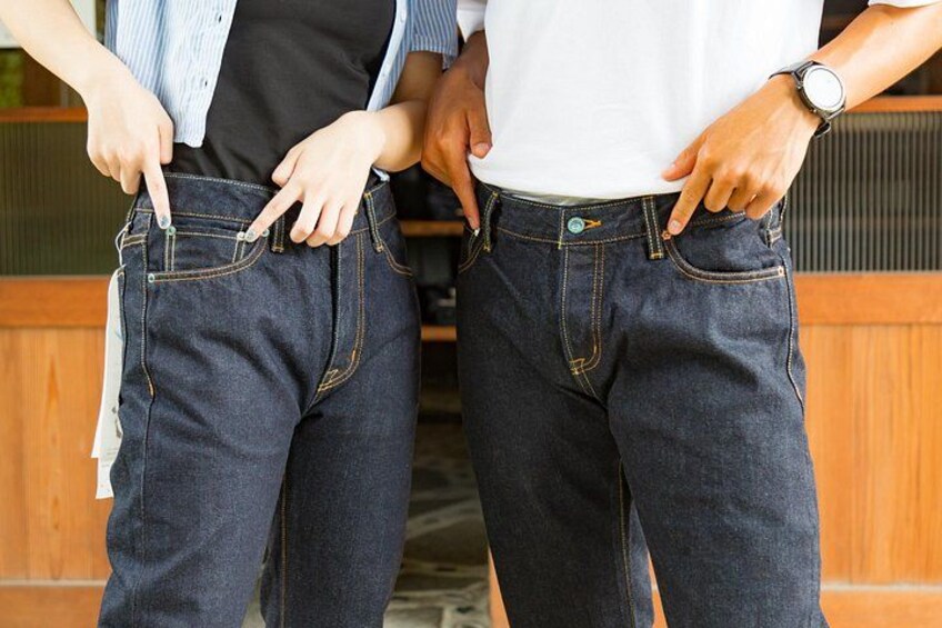 Two people wearing jeans with visible pockets and buttons. 5