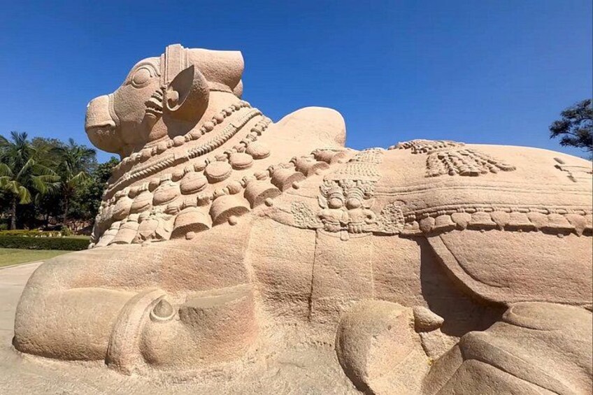 A large sand sculpture of a horse with intricate details and a headdress. 4