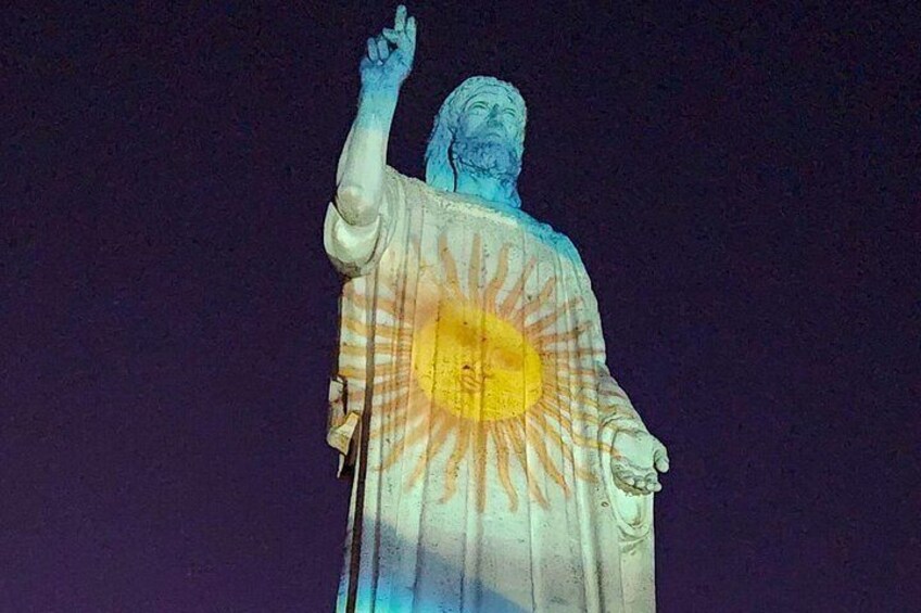 A statue with a radiant design on its back. 4