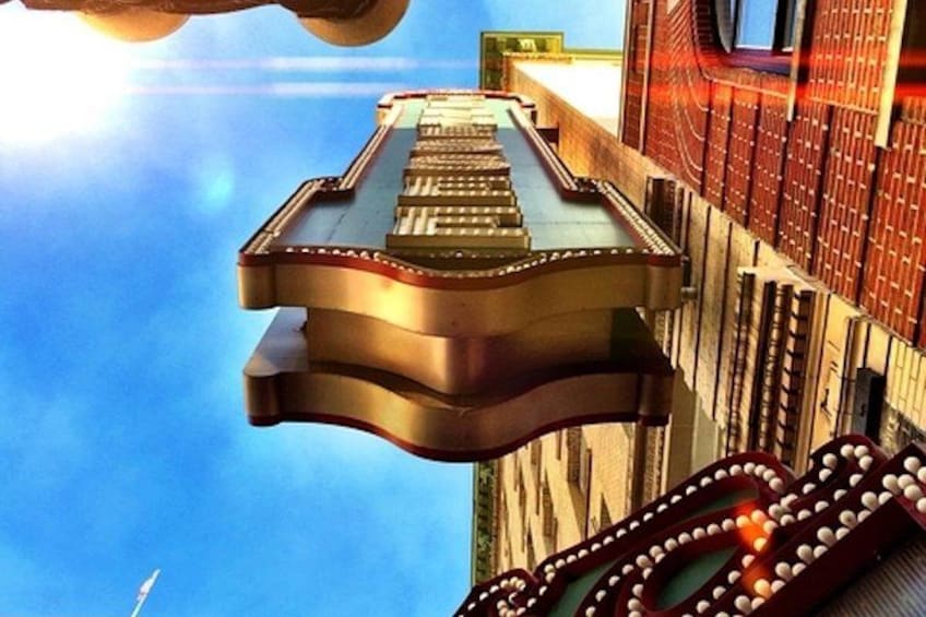A floating platform with a staircase leading to a building with a red brick facade. 2