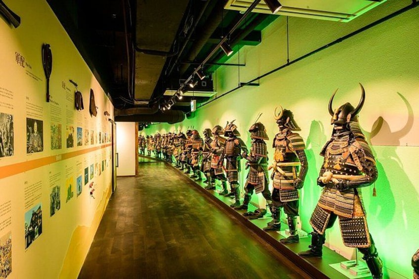 A museum exhibit with samurai armor on display. 5
