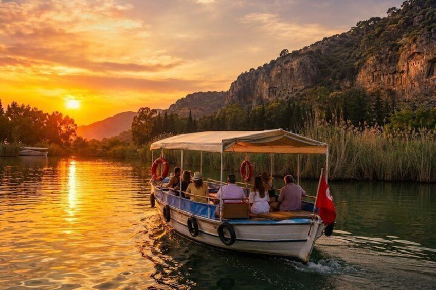 A boat with passengers on a river at sunset. 1