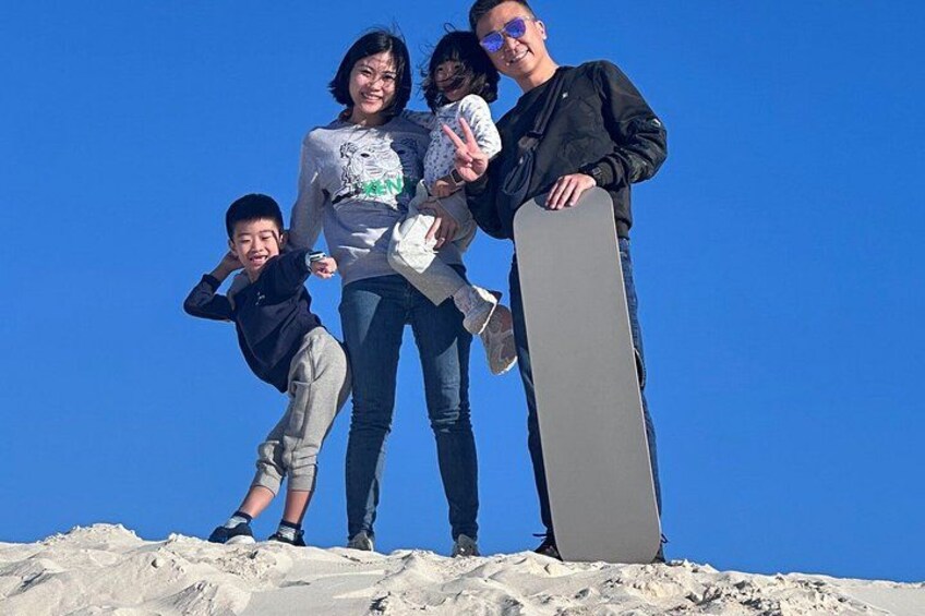 A group of people on a snowy mountain with a snowboard. 5