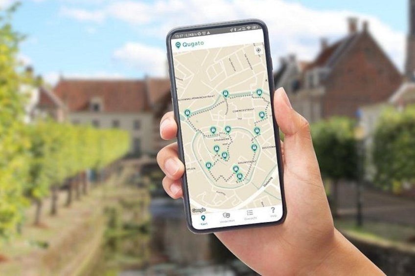 A hand holding a smartphone displaying a map with a location marked 'Gugato.' 1