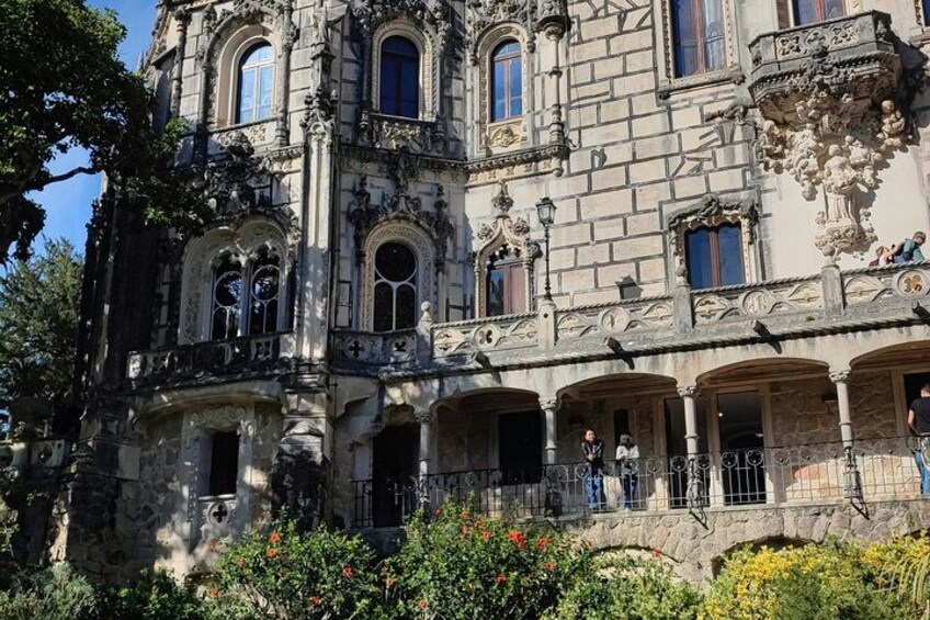 A historic building with ornate architecture, including arched windows and decorative stonework. 2