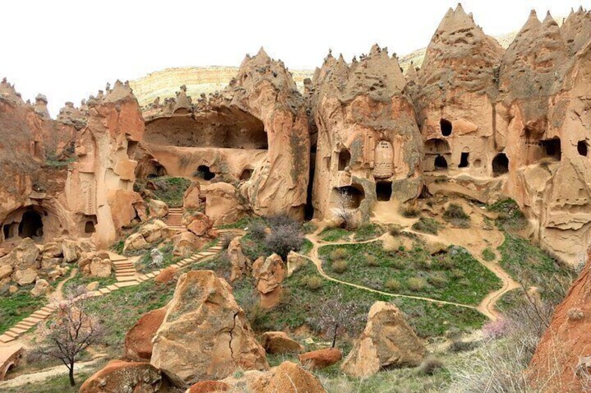 A rocky landscape with ancient rock formations and a winding path. 1