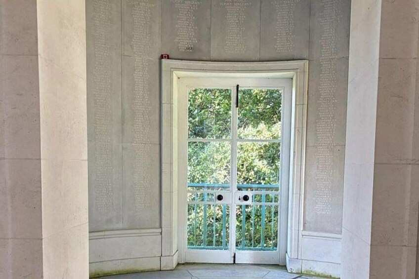 A white door with a glass panel and a small balcony. 3