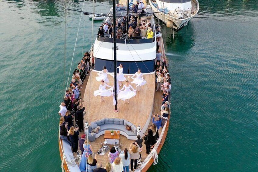 A wedding ceremony on a boat with guests seated on the deck. 4