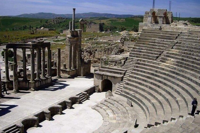 Ancient ruins with columns and an amphitheater. 3