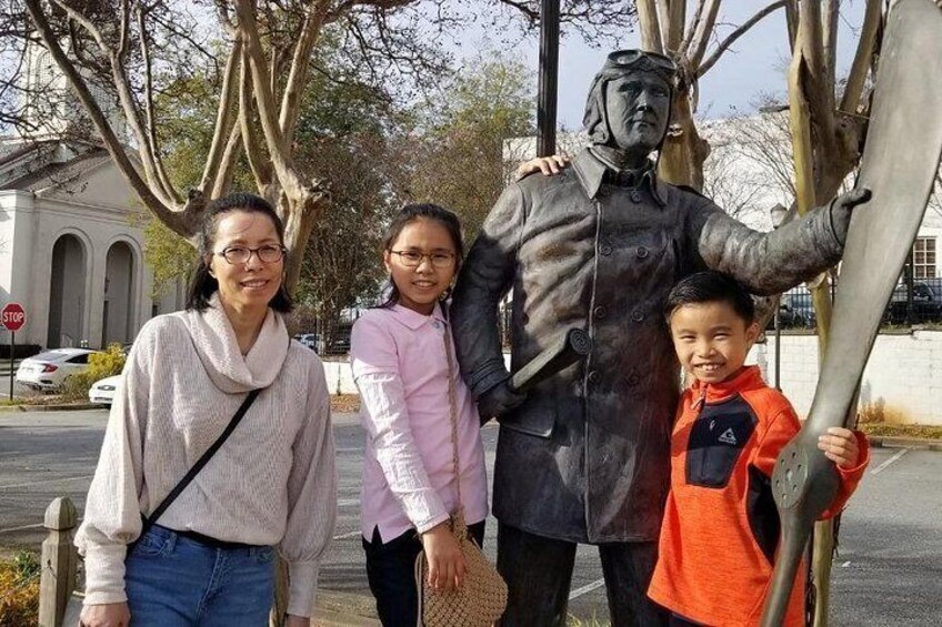 A statue of a man with a child and a woman. 3