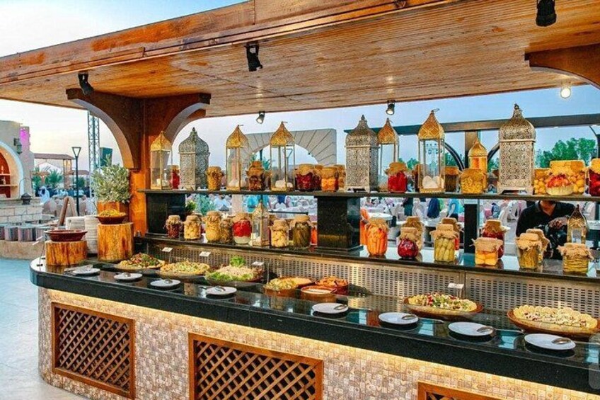 A food stall with various dishes and jars of spices. 5