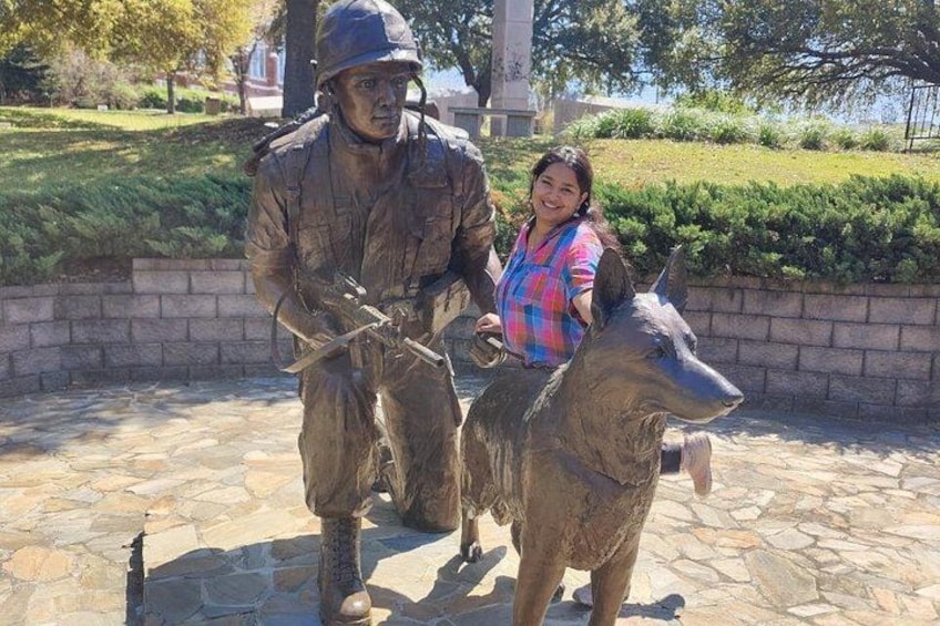 A statue of a soldier with a dog. 3