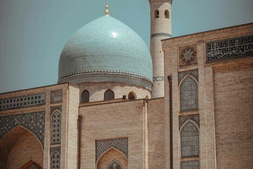 A mosque with a large dome and minarets. 5