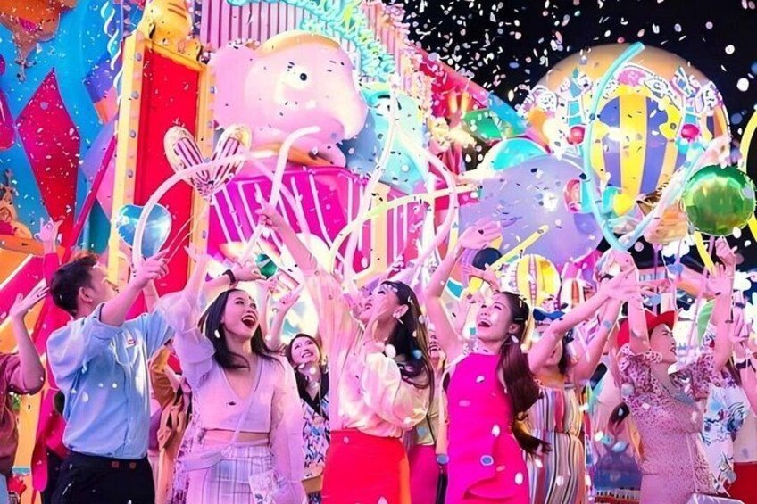 A colorful amusement park with a large Ferris wheel and various rides. 1