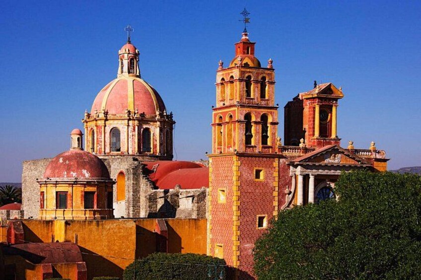 A historic church with a prominent dome and bell tower. 2