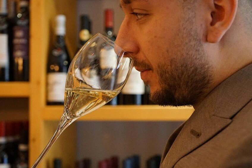 A person holding a wine glass. 2