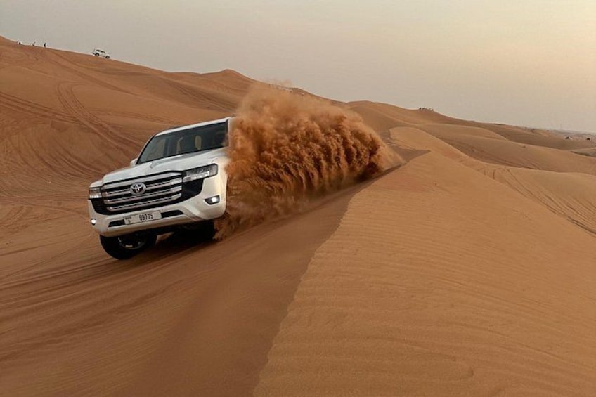 Dubai Red Dunes Safari: Dune Bashing, Camel, BBQ & Shows 1