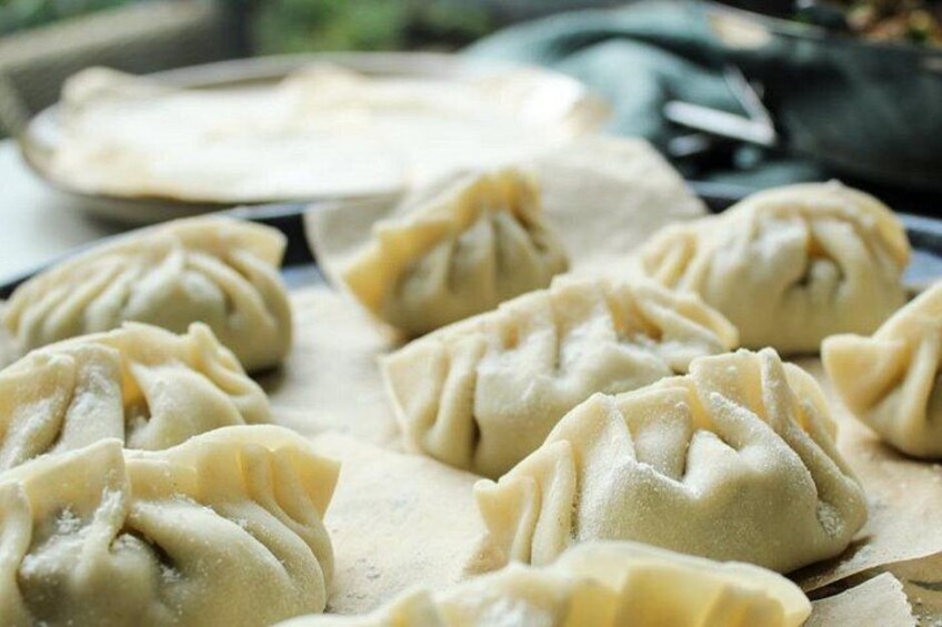 Dumplings on a baking tray. 1