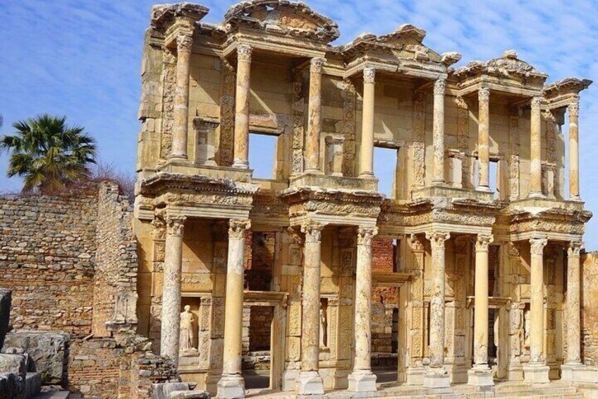 An ancient ruin with multiple columns and intricate carvings. 3