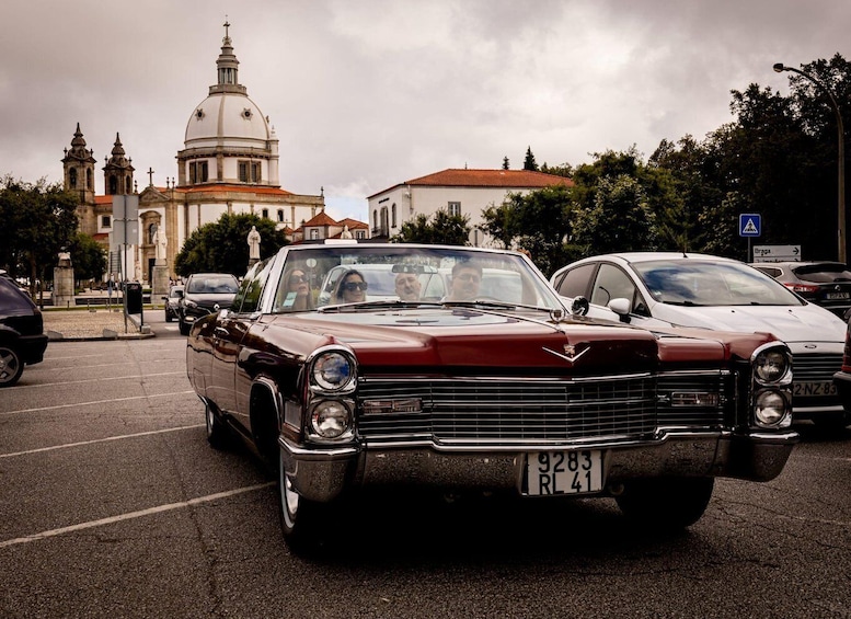 A vintage car with a license plate RL 41 parked in a lot. 2
