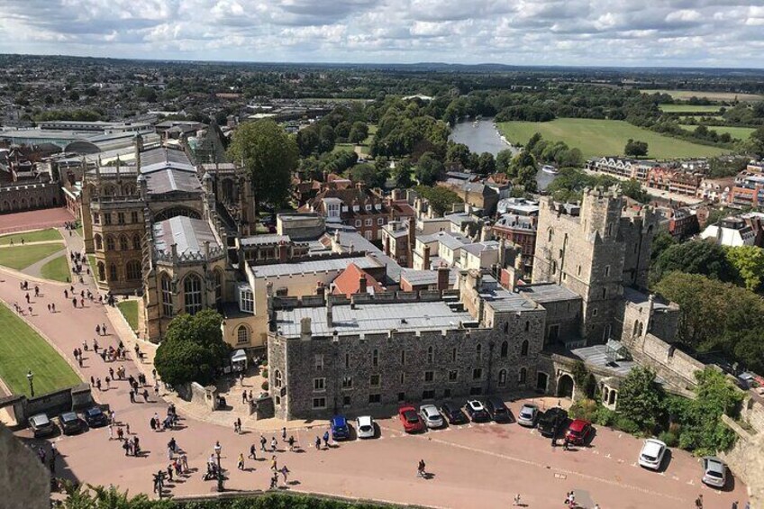 A historic castle with a large courtyard and surrounding buildings. 4