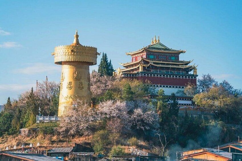 A traditional Chinese pagoda and a multi-tiered building with intricate architecture. 2