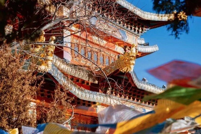 A traditional building with ornate architecture, including curved roofs and decorative elements. 4