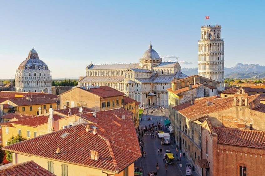 The Leaning Tower of Pisa, the Pisa Cathedral, and the Palazzo Pubblico in Pisa, Italy. 1