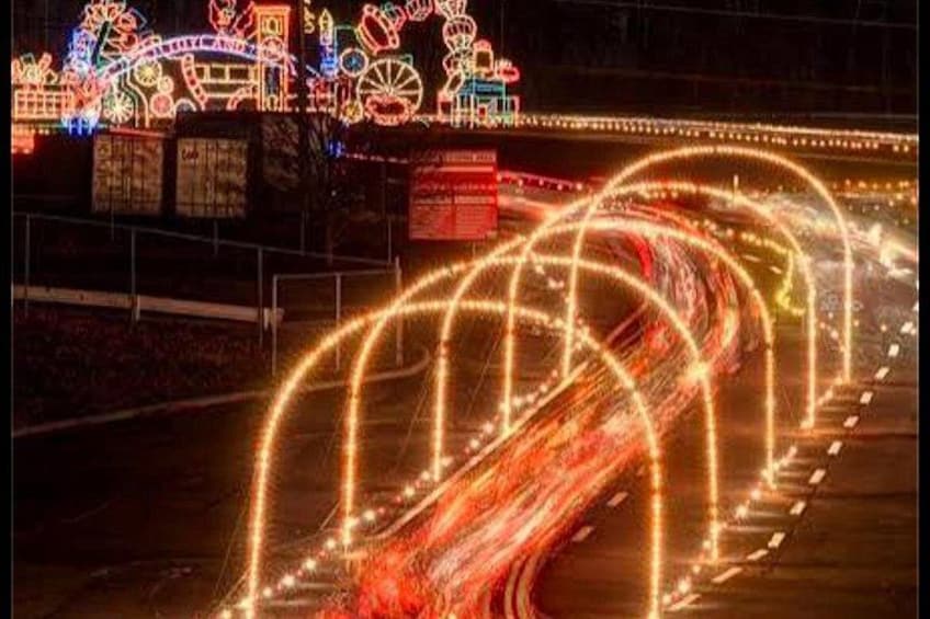 A brightly lit amusement park with neon lights and a Ferris wheel. 4