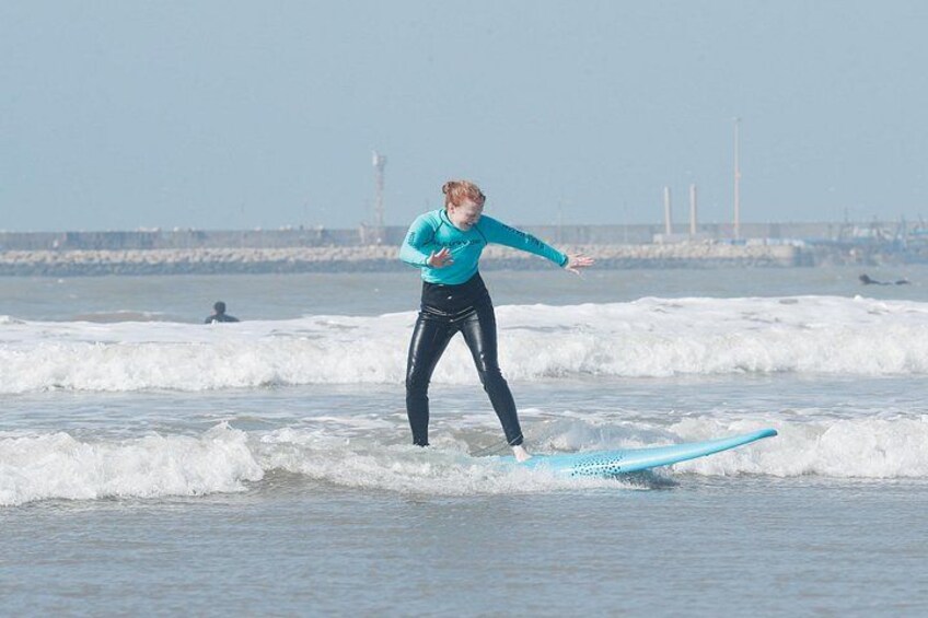 A person surfing on a wave. 3