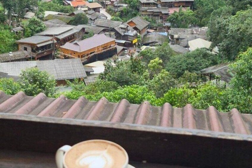 A traditional village with wooden houses and a tiled roof. 3