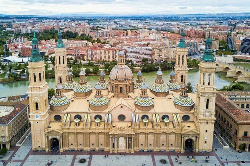 A large cathedral with multiple domes and towers, surrounded by a cityscape and a river. 4