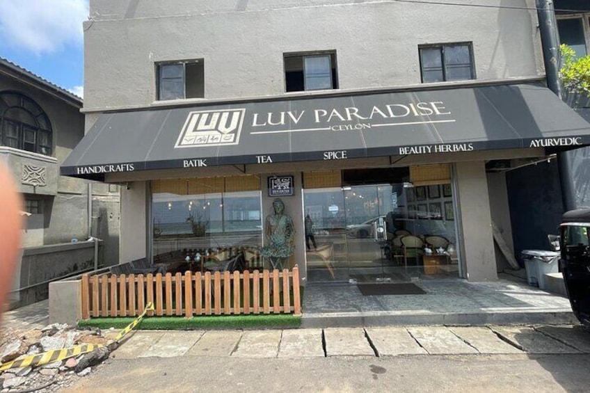 A storefront named 'LUV PARADISE' with sections for handicrafts, batik, tea, spice, and beauty herbs. 2