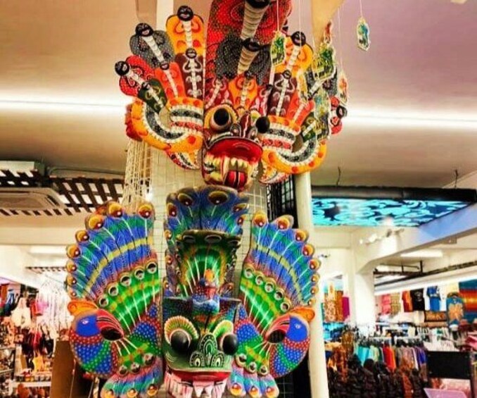 A colorful peacock head sculpture in a store. 4