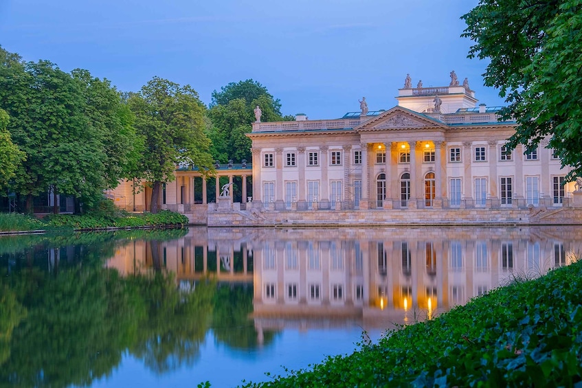 A grand classical building with a reflecting pool in front. 3