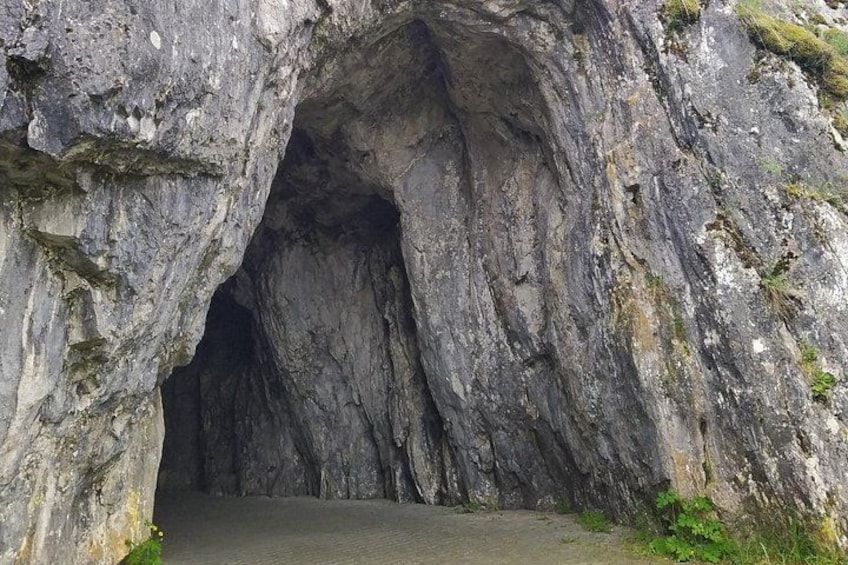 A cave entrance with a narrow passageway. 2