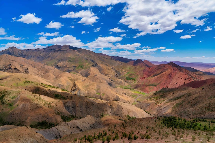 A mountainous landscape with varying elevations and sparse vegetation. 4