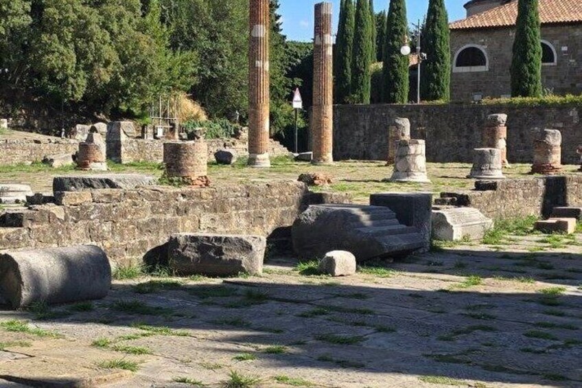 Ancient ruins with columns and stone structures. 2