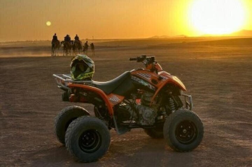 An off-road vehicle in a desert landscape during sunset. 3
