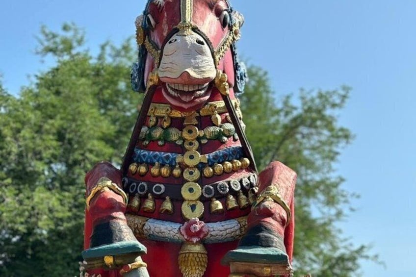 A colorful statue of a horse with intricate decorations. 4