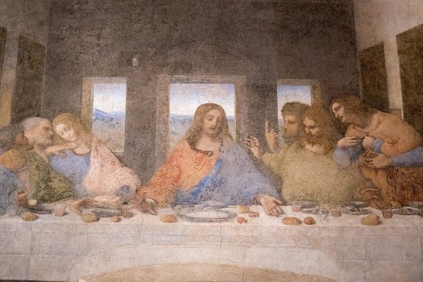 A fresco of a group of people seated around a table, with a landscape visible through windows in the background. 1