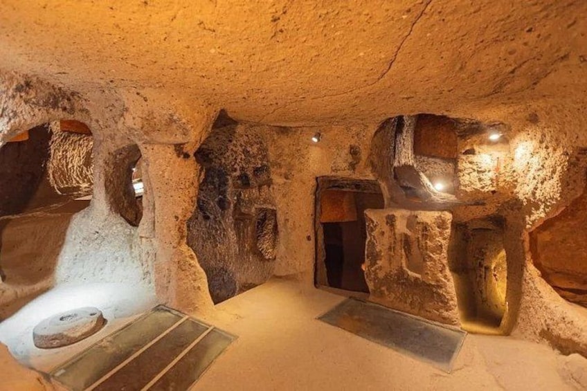 An underground cave with natural rock formations and a metal grate. 2