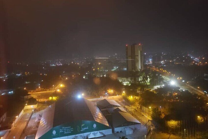 A nighttime cityscape with illuminated buildings and streets. 4