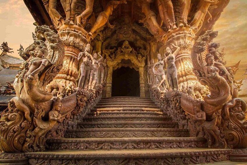 Ornate temple stairs with intricate carvings and statues. 2