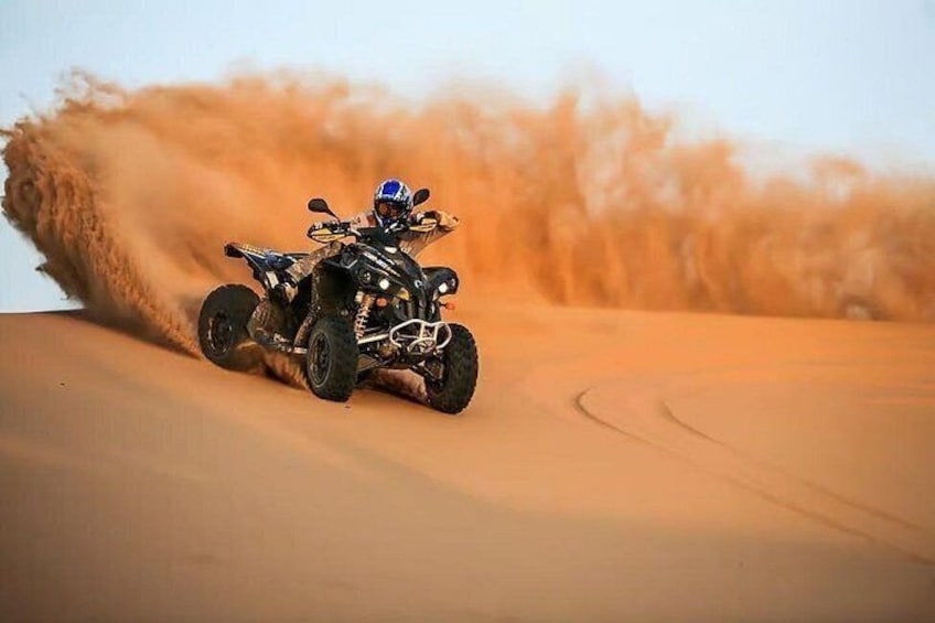 A quad bike on a sandy dune. 2