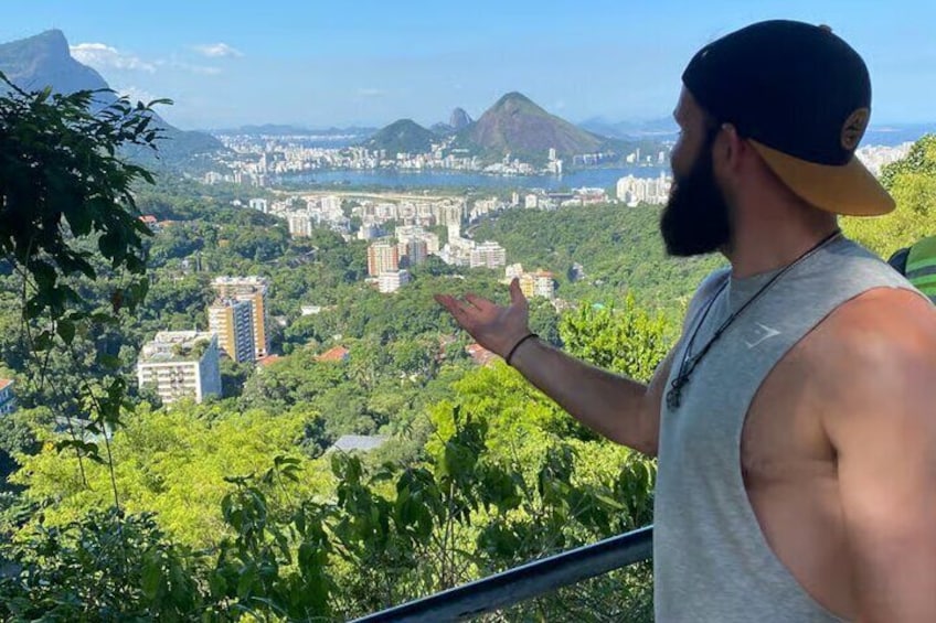 A person overlooking a cityscape with mountains in the background. 4