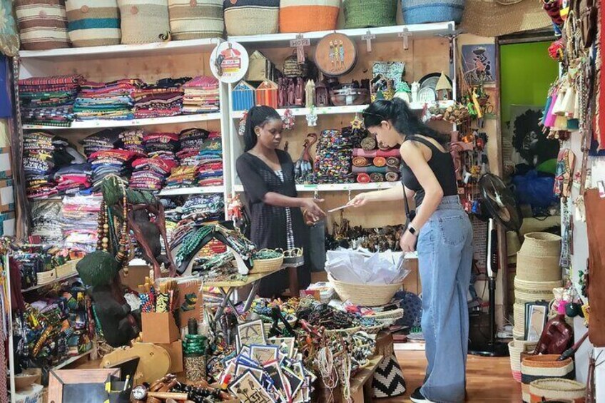 A market stall with various textiles and accessories. 5