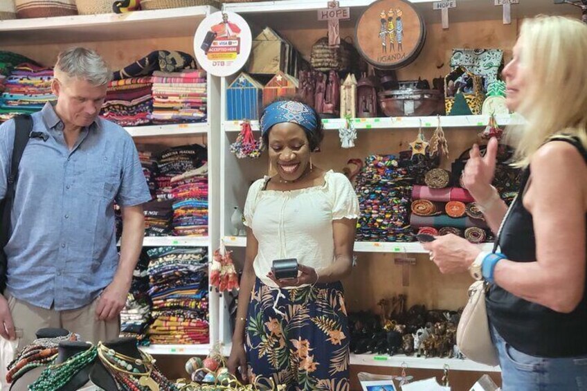 A market stall with colorful textiles and jewelry. 3