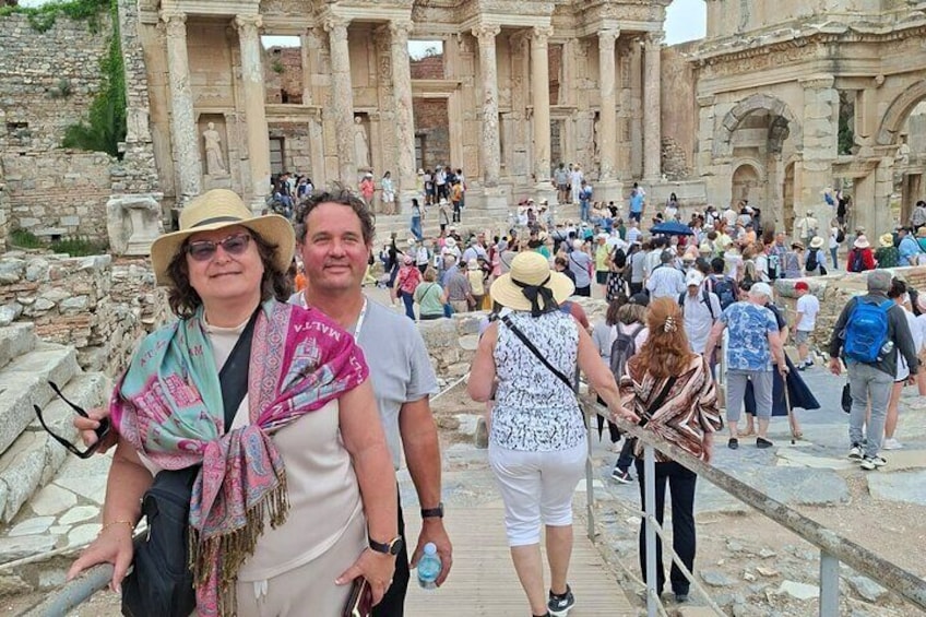 Tourists at an ancient ruin with columns and steps. 3