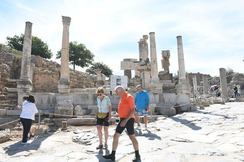 Ancient ruins with columns and stone structures. 3
